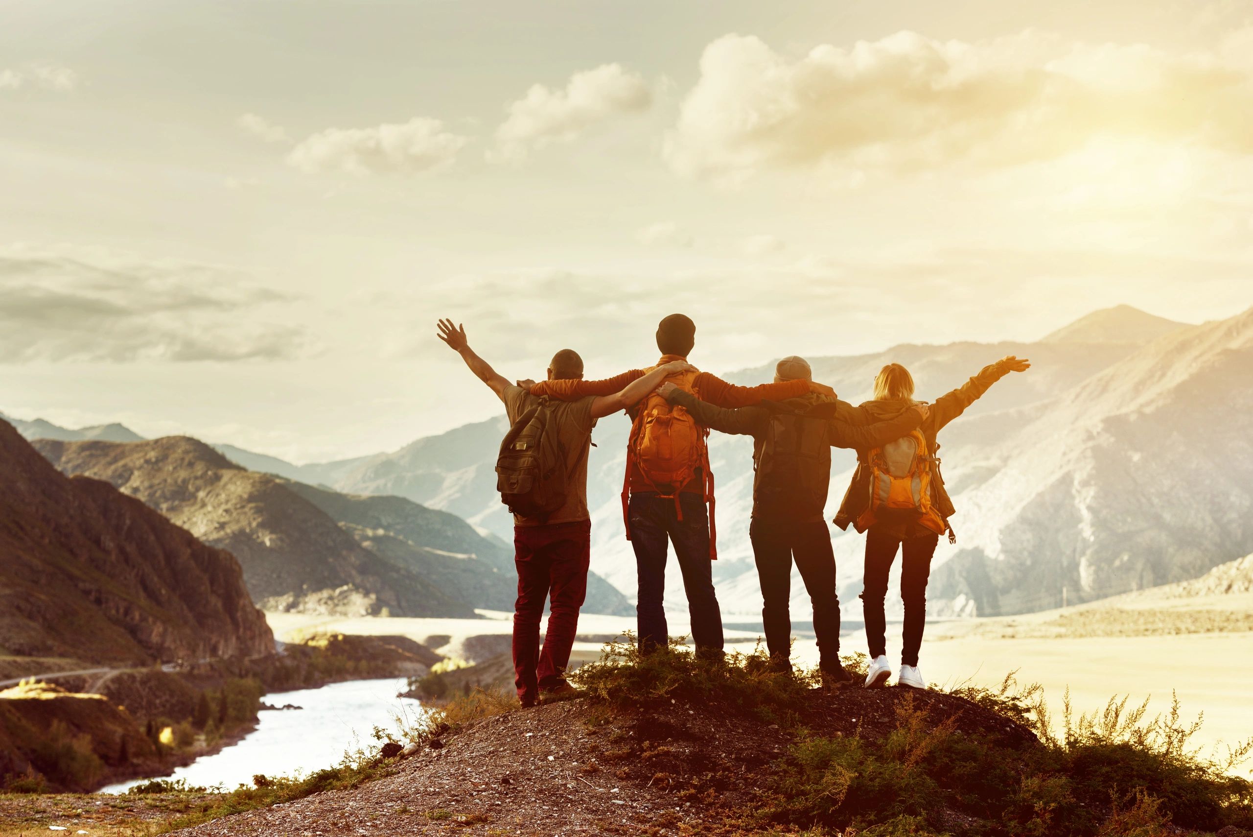 Travelers enjoying a scenic view during a group hike.